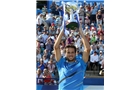 EASTBOURNE, ENGLAND - JUNE 21:  Feliciano Lopez of Spain celebrates with the trophy after beating Richard Gasquet of France during their Men's Singles Finals match on day eight of the Aegon International at Devonshire Park on June 21, 2014 in Eastbourne, England. (Photo by Jan Kruger/Getty Images)